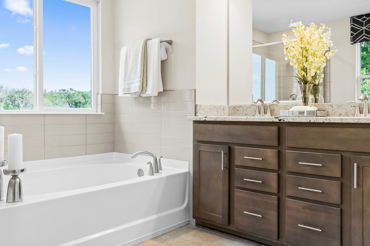 Garden tub with tile surround at primary bath