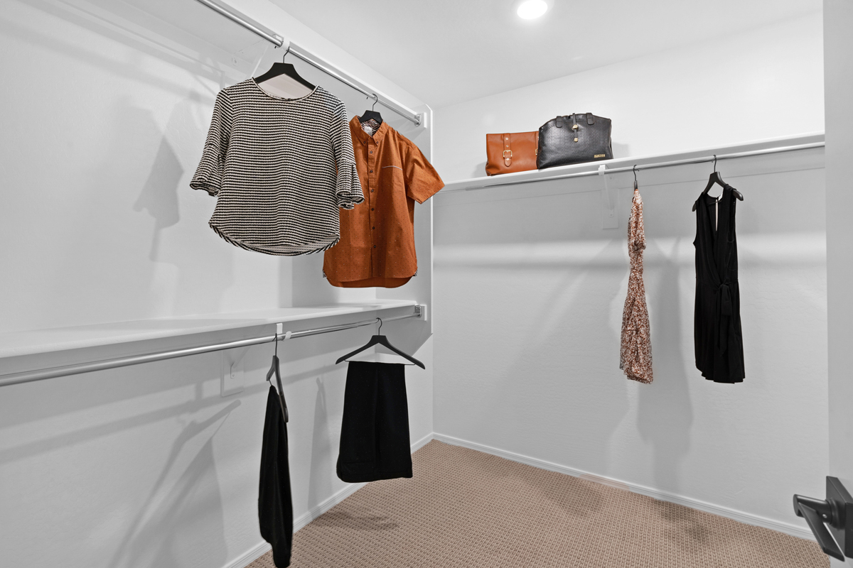 Walk-in closet at primary suite
