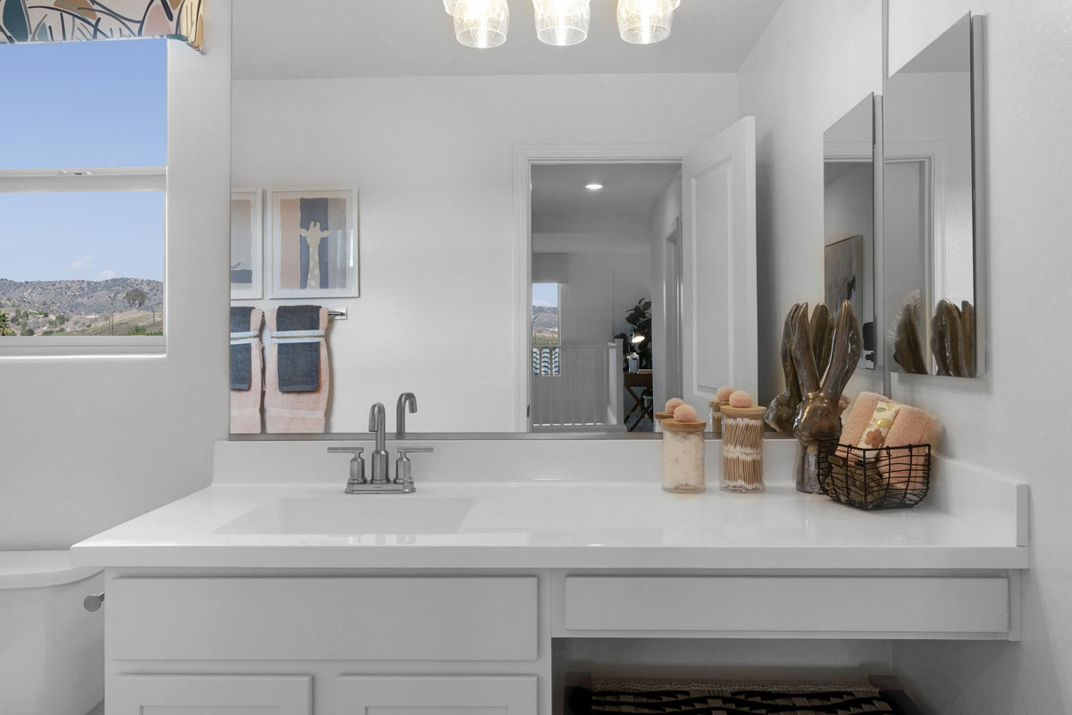 Extended vanity with knee space at secondary bath