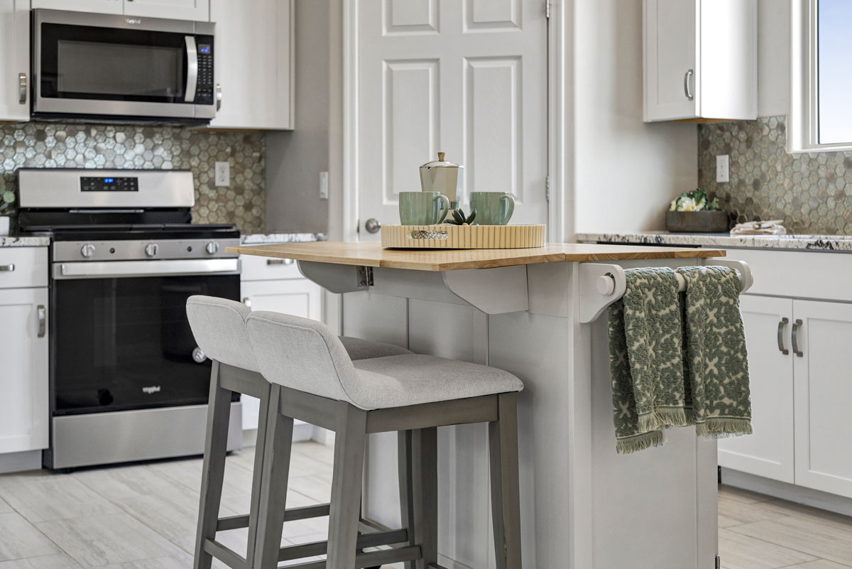 Tile backsplash at kitchen 