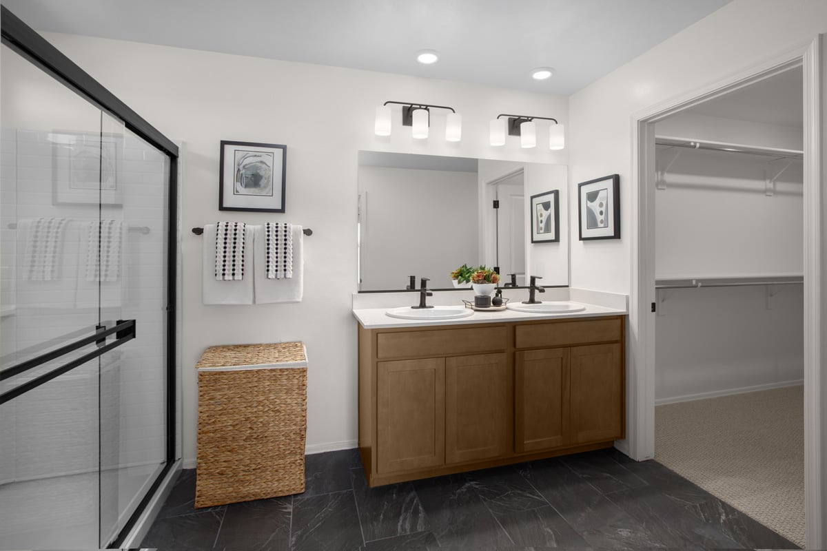 Upgraded shower with cultured marble surround at primary bath