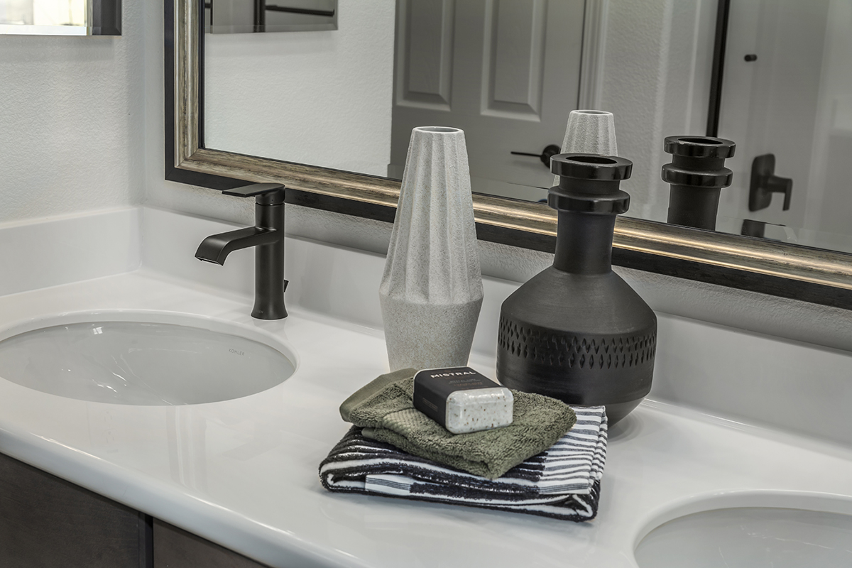 Dual-sink vanity at primary bathroom