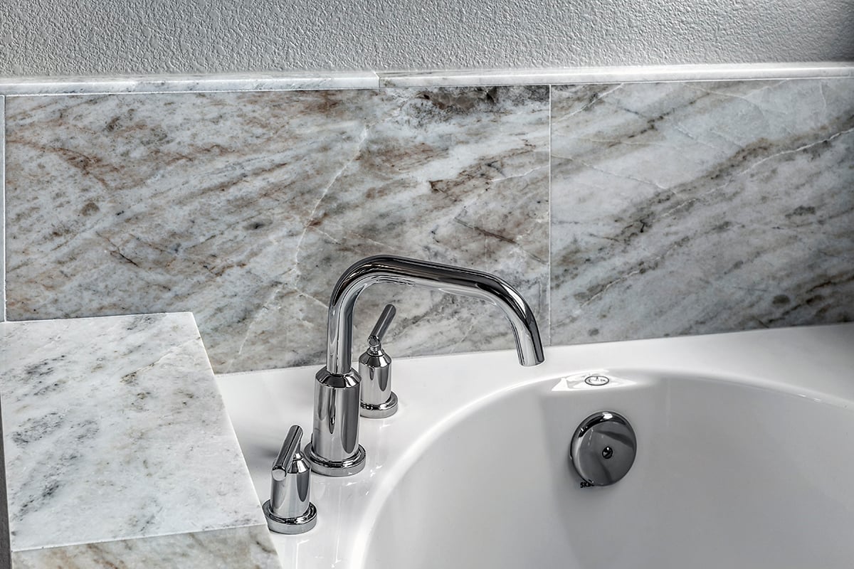 Tub with marble surround at primary bath