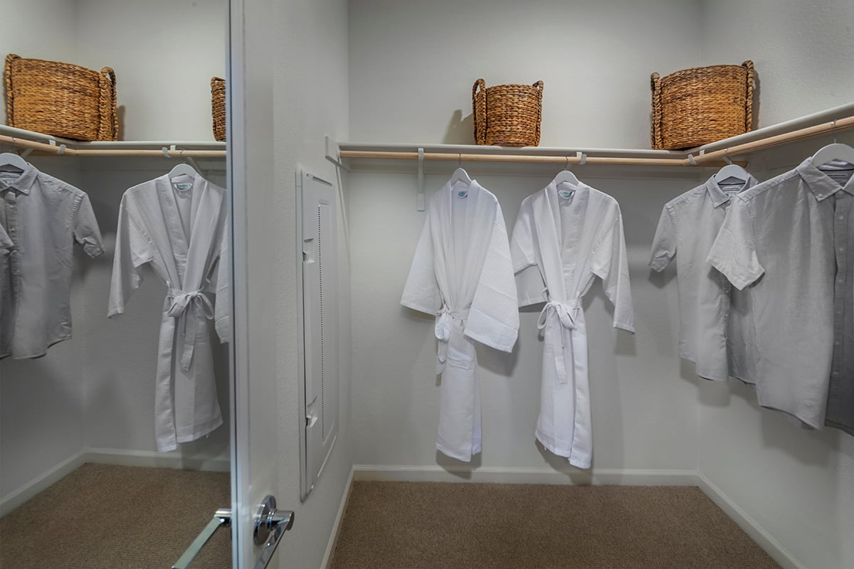 Walk-in closet at primary bedroom