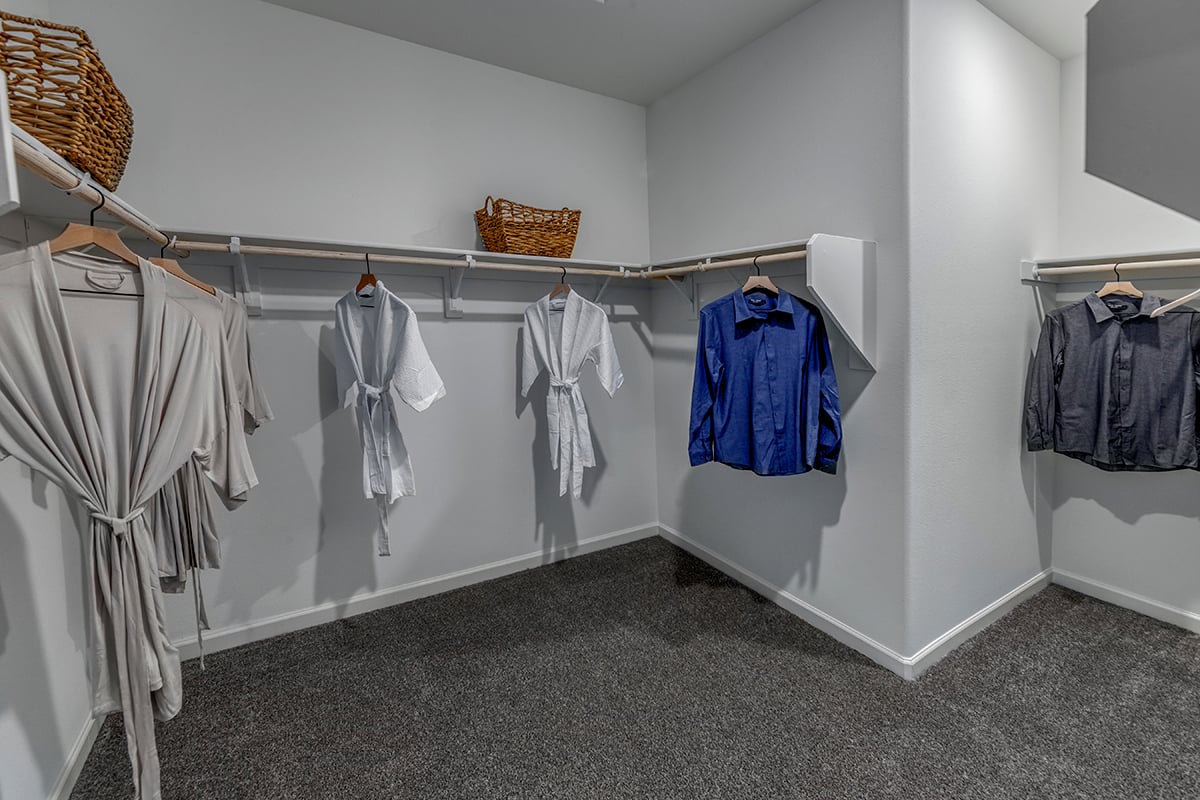 Walk-in closet at primary bedroom