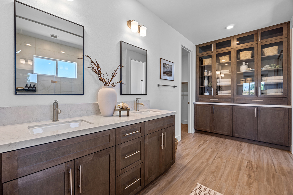 Curio cabinets at primary bath