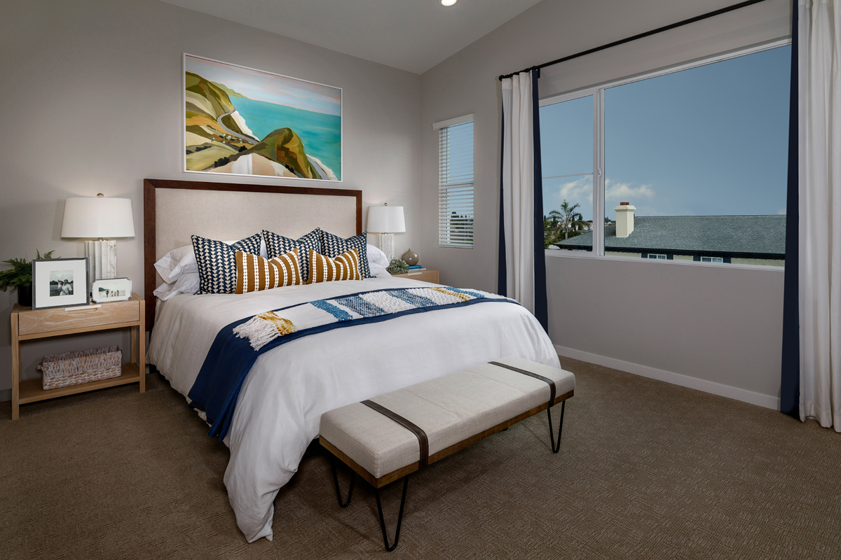 KB model home primary bedroom in Stanton, CA