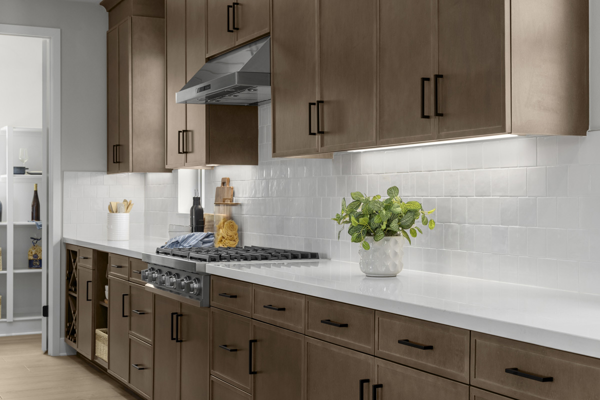 Optional upgraded quartz countertops and tile backsplash