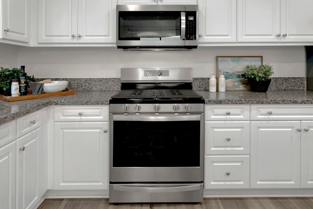 Included White Thermofoil cabinets and appliances