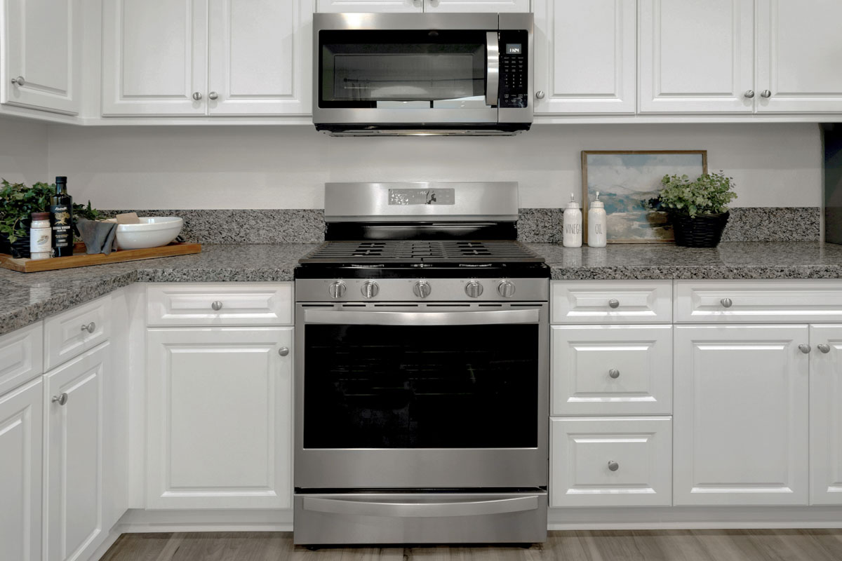 Included White Thermofoil cabinets and appliances