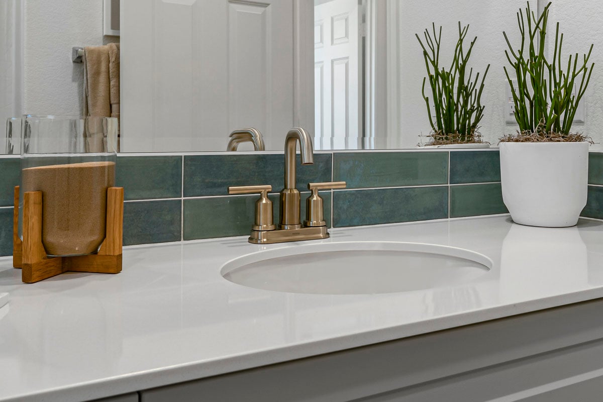 Upgraded bathroom faucet and tile backsplash