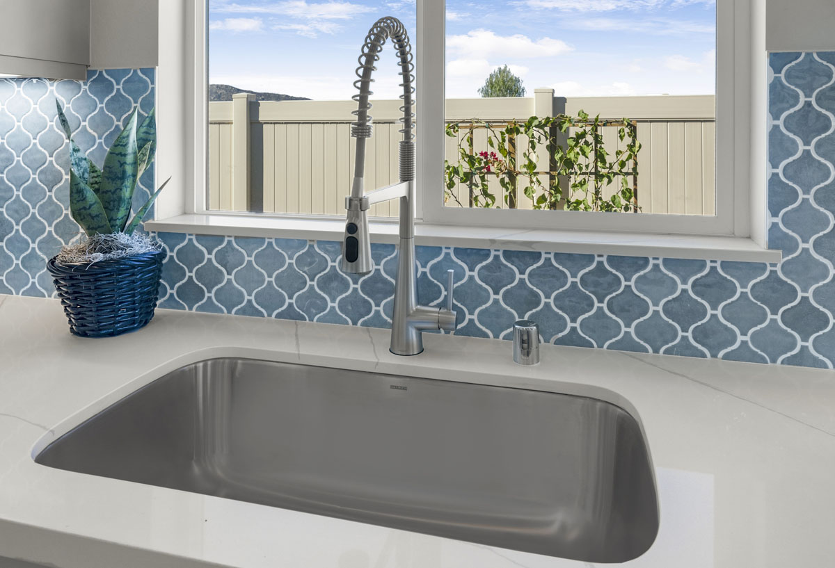 Optional single basin sink and drop down faucet at kitchen