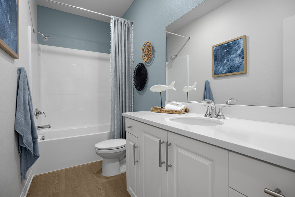 Engineered stone countertops at full baths