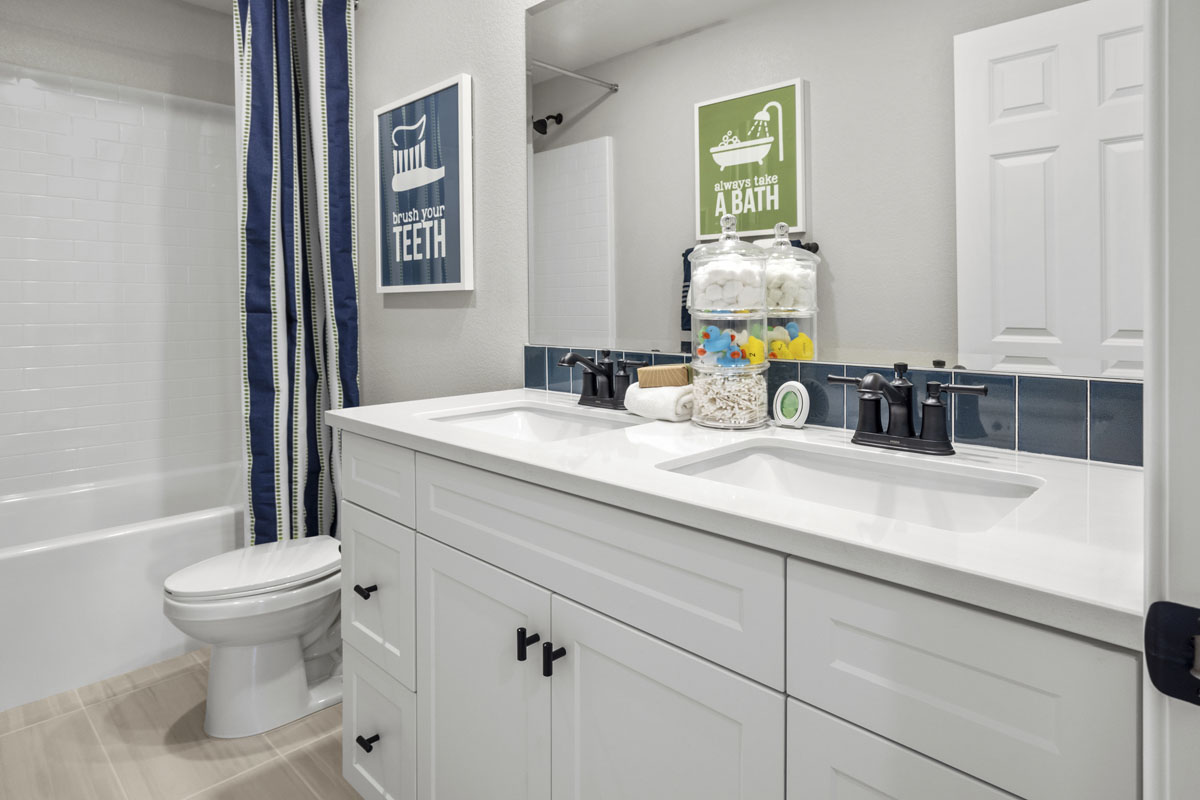 Upgraded dual-sink vanity at secondary bath