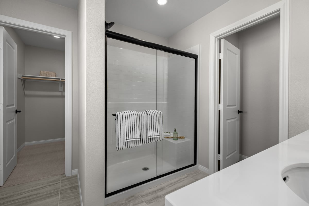 Optional matte black shower enclosure at primary bath