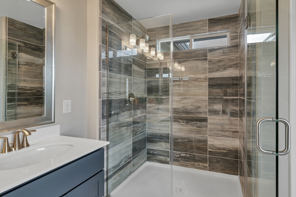 Shower with tile surround at primary bath
