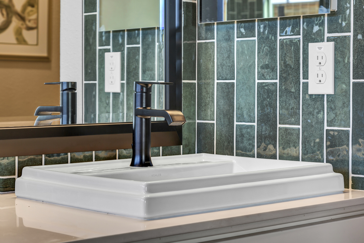 Raised sink and matte black faucet