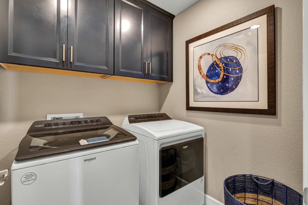 Laundry room with upper cabinets