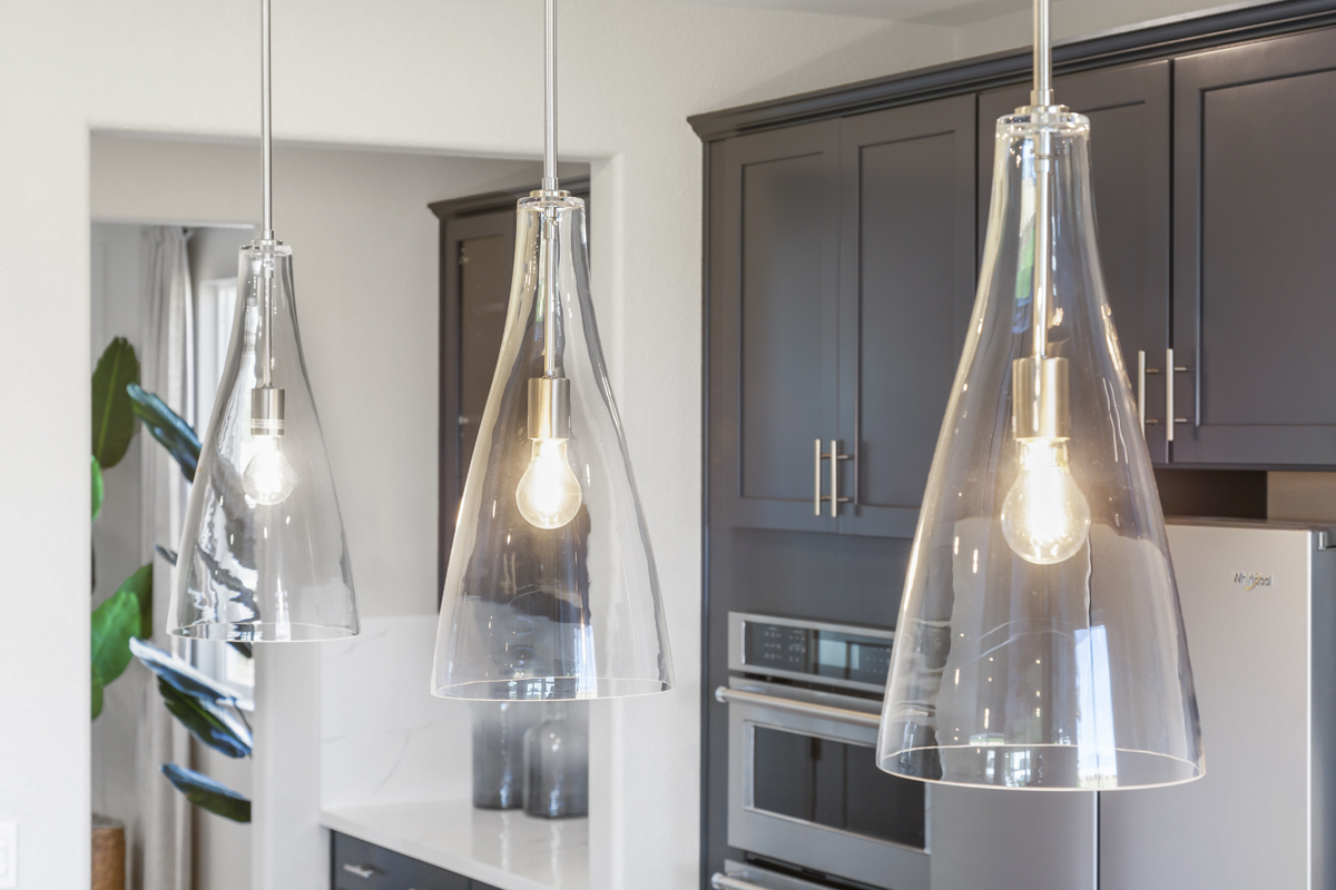 Upgraded pendant lights above kitchen island