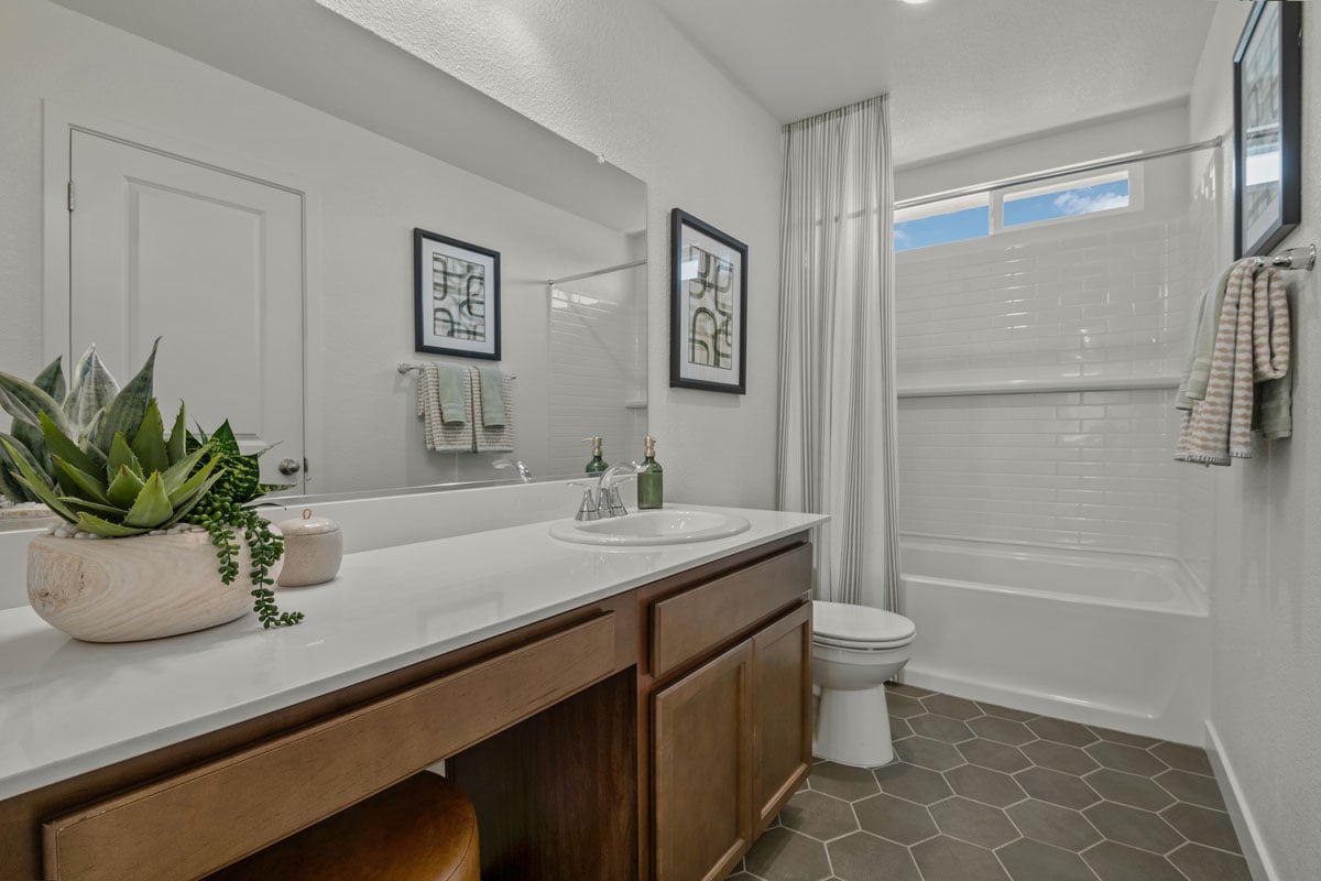 Extended vanity with solid-surface countertops and knee space at bath 2