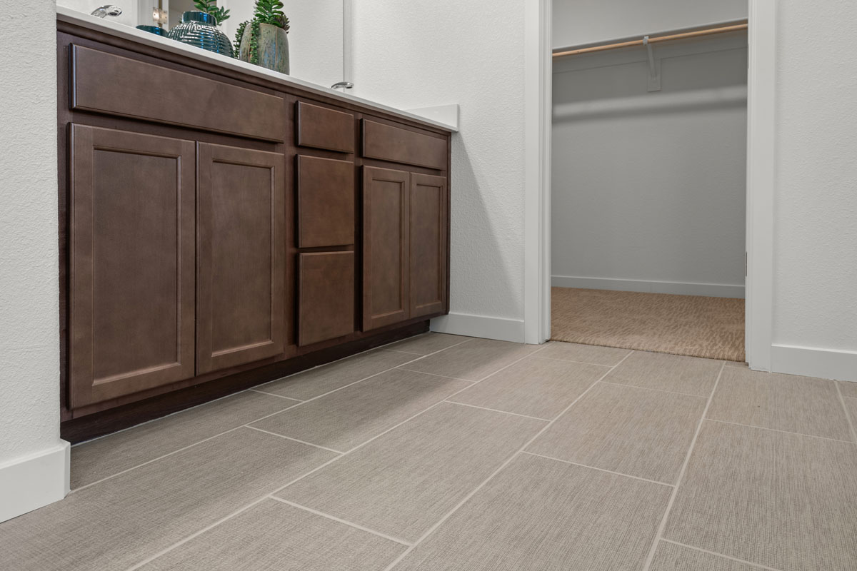 Tile flooring at primary bath