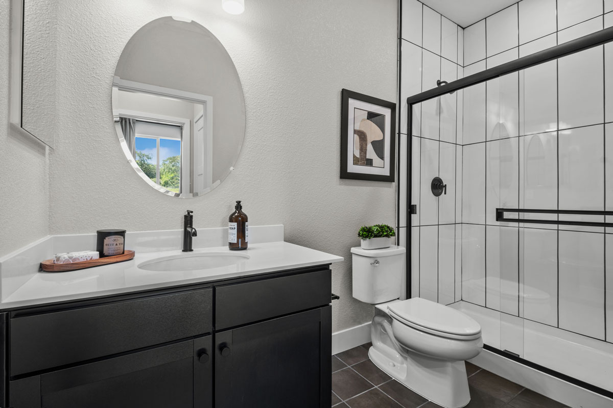 Walk-in shower with tile surround at bath 2
