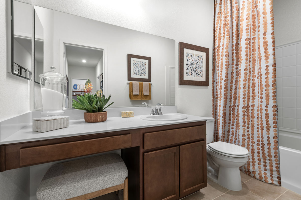 Extended vanity with solid-surface countertop and knee space at bath 2