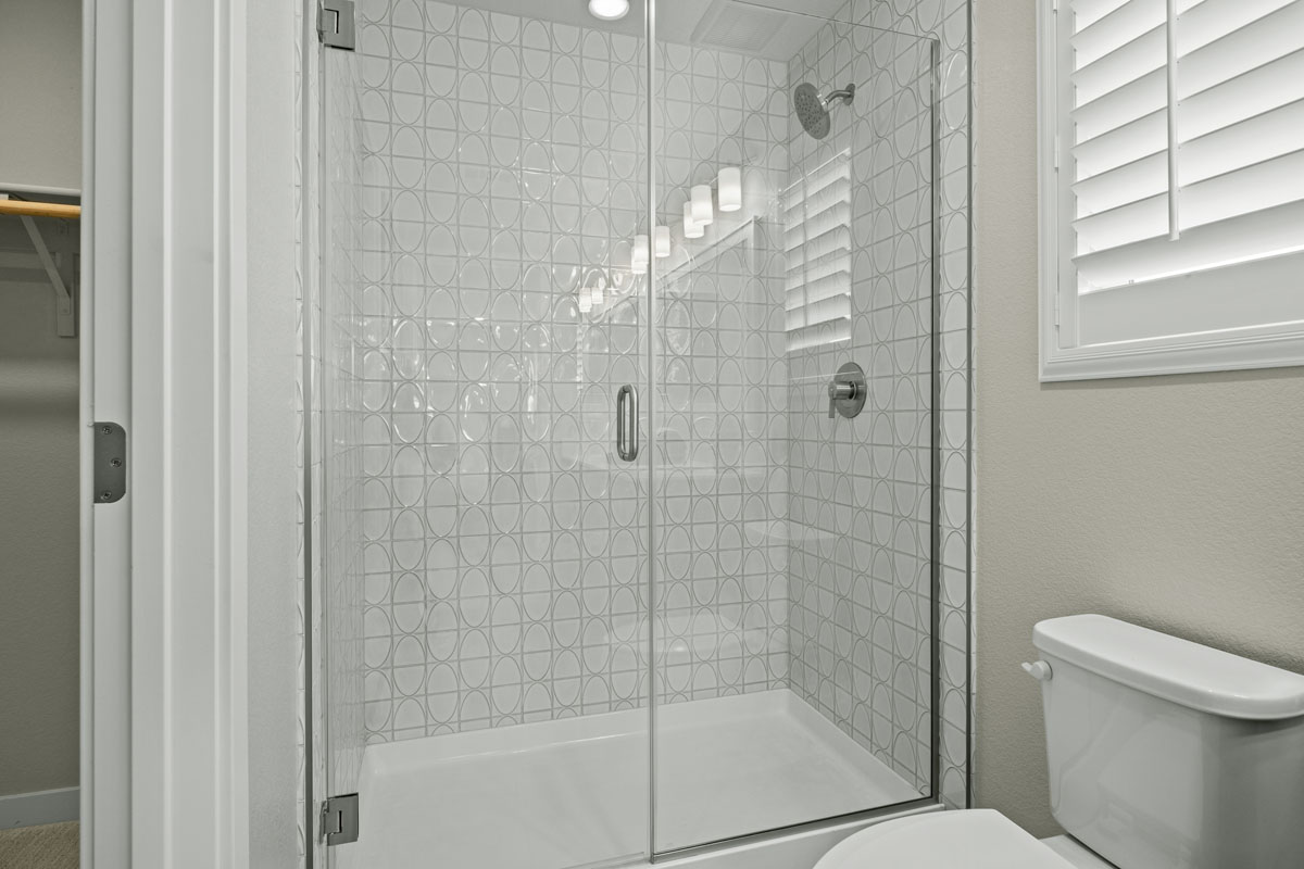 Walk-in shower with custom tile surround