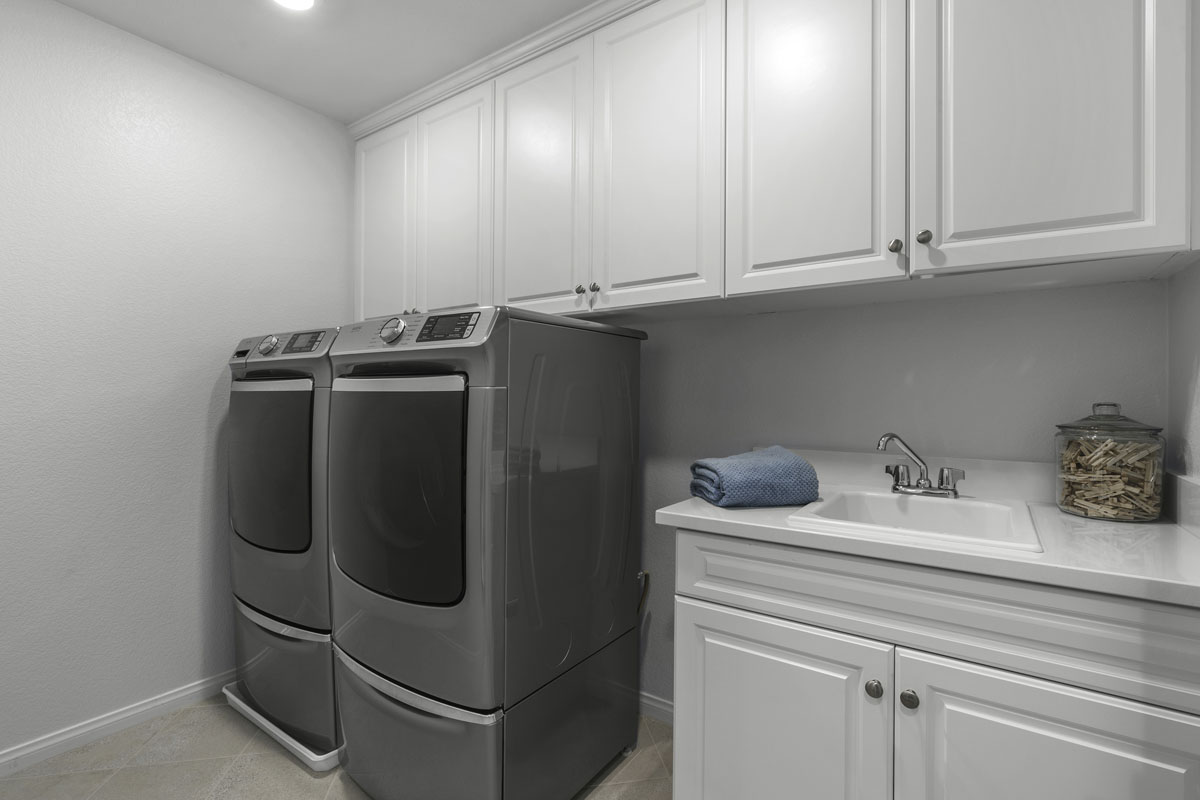 Upgraded laundry sink and cabinets