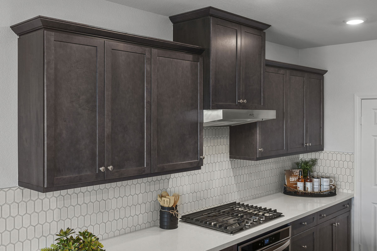 Upgraded quartz kitchen countertops and tile backsplash