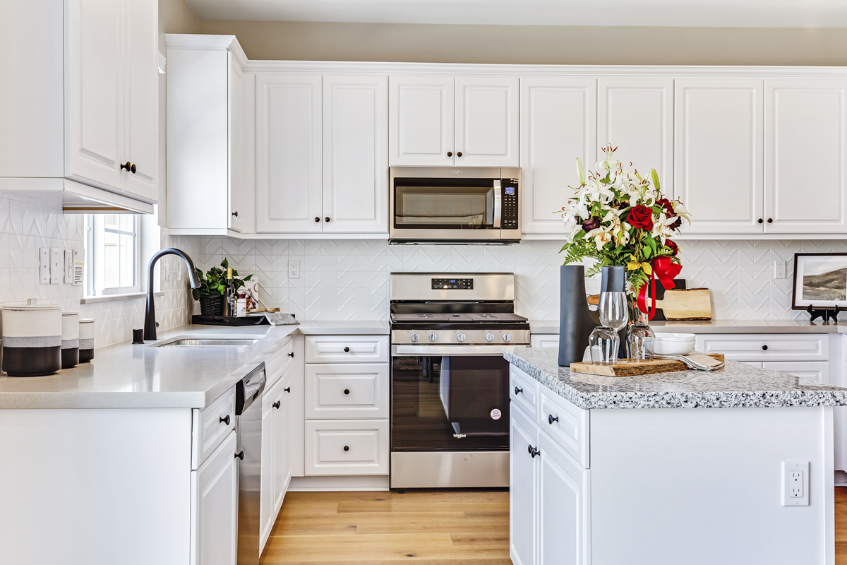 White thermofoil raised-panel cabinets