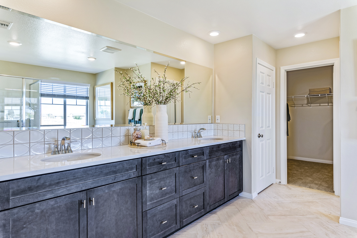 Upgraded extended vanity with cabinets at primary bath