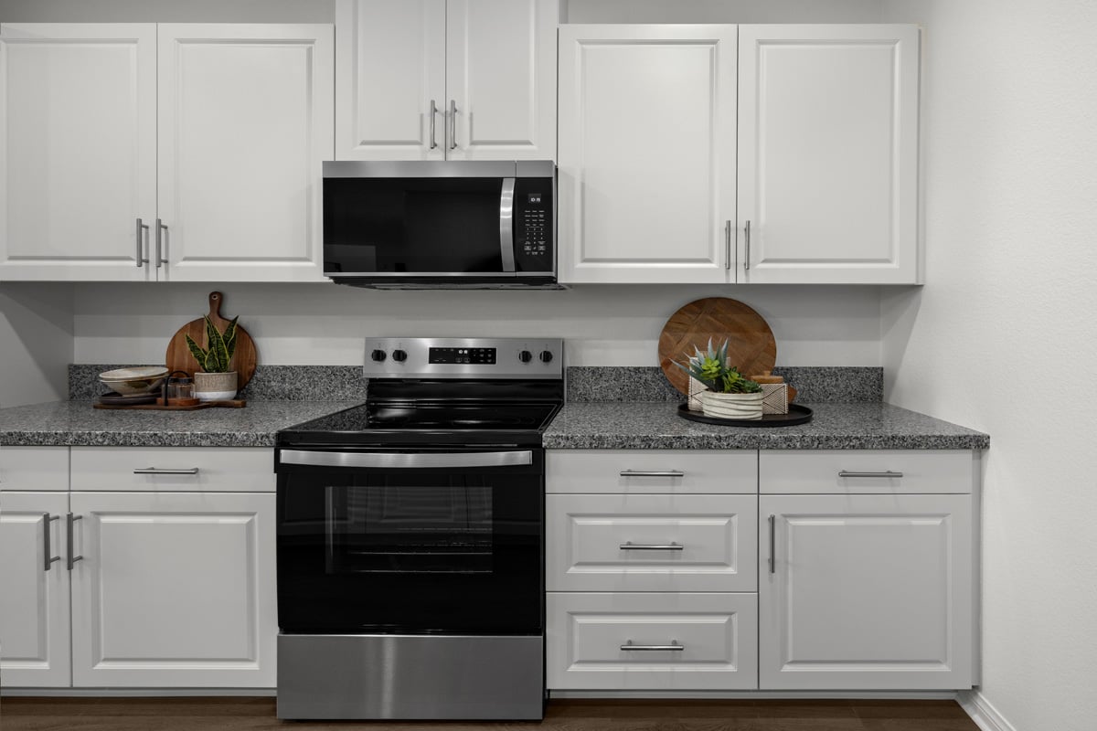 White thermofoil cabinets with satin nickel pulls