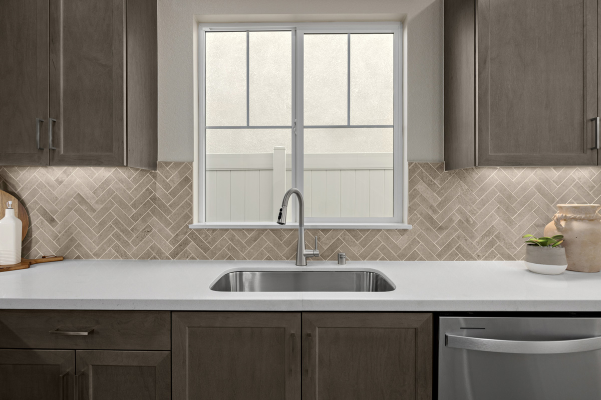 Optional custom tile backsplash at kitchen