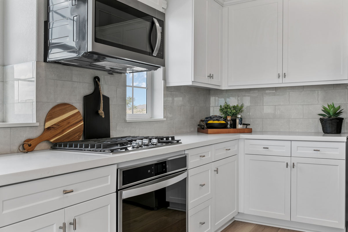 Upgraded quartz countertops and full tile backsplash