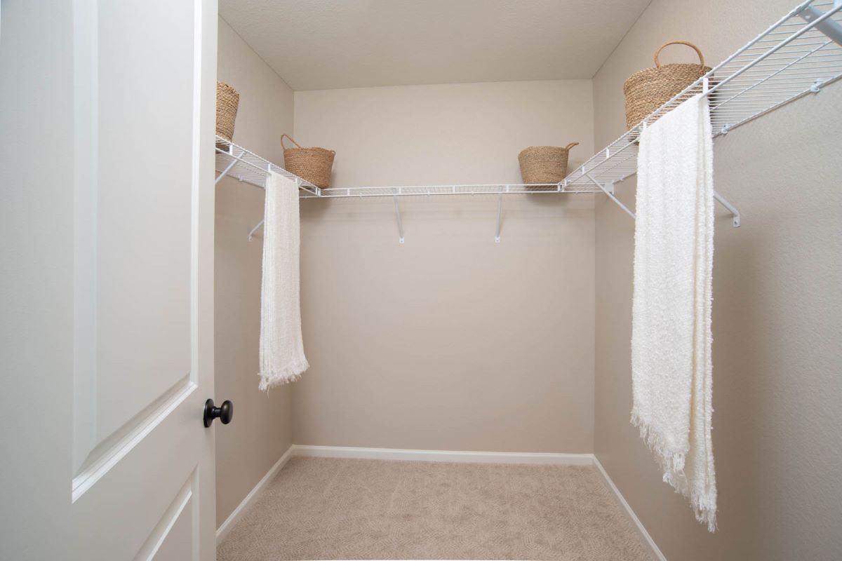 Large walk-in closet at primary suite