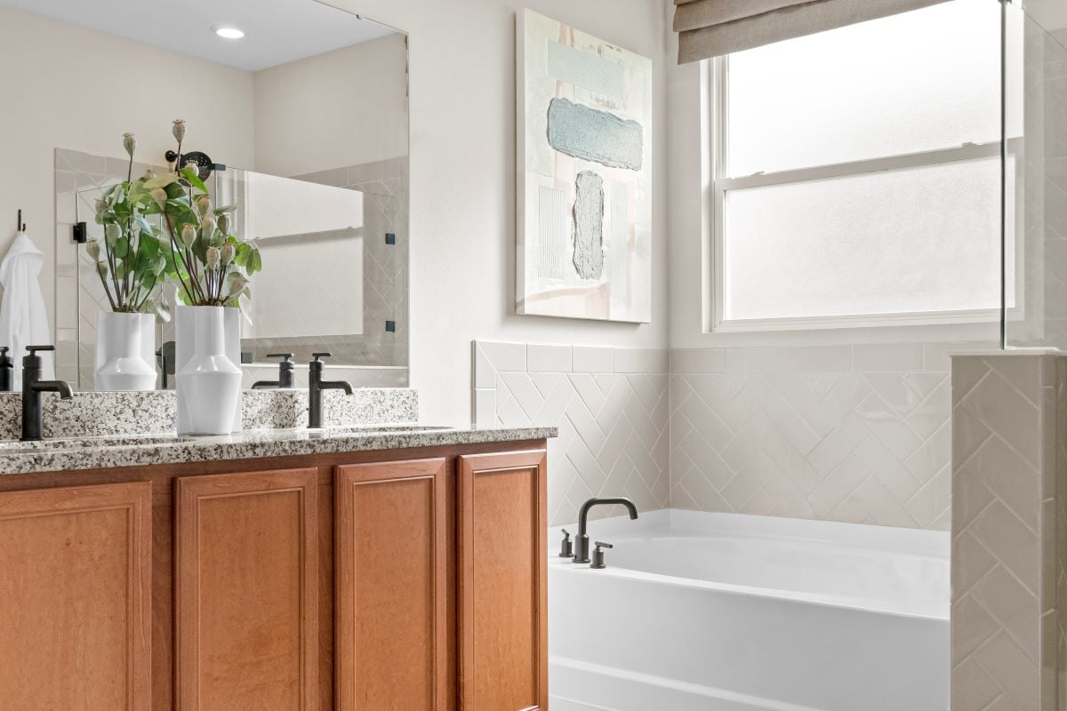 Garden tub with tile surround at primary bath
