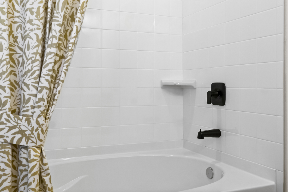 Garden tub with tile surround at primary bath