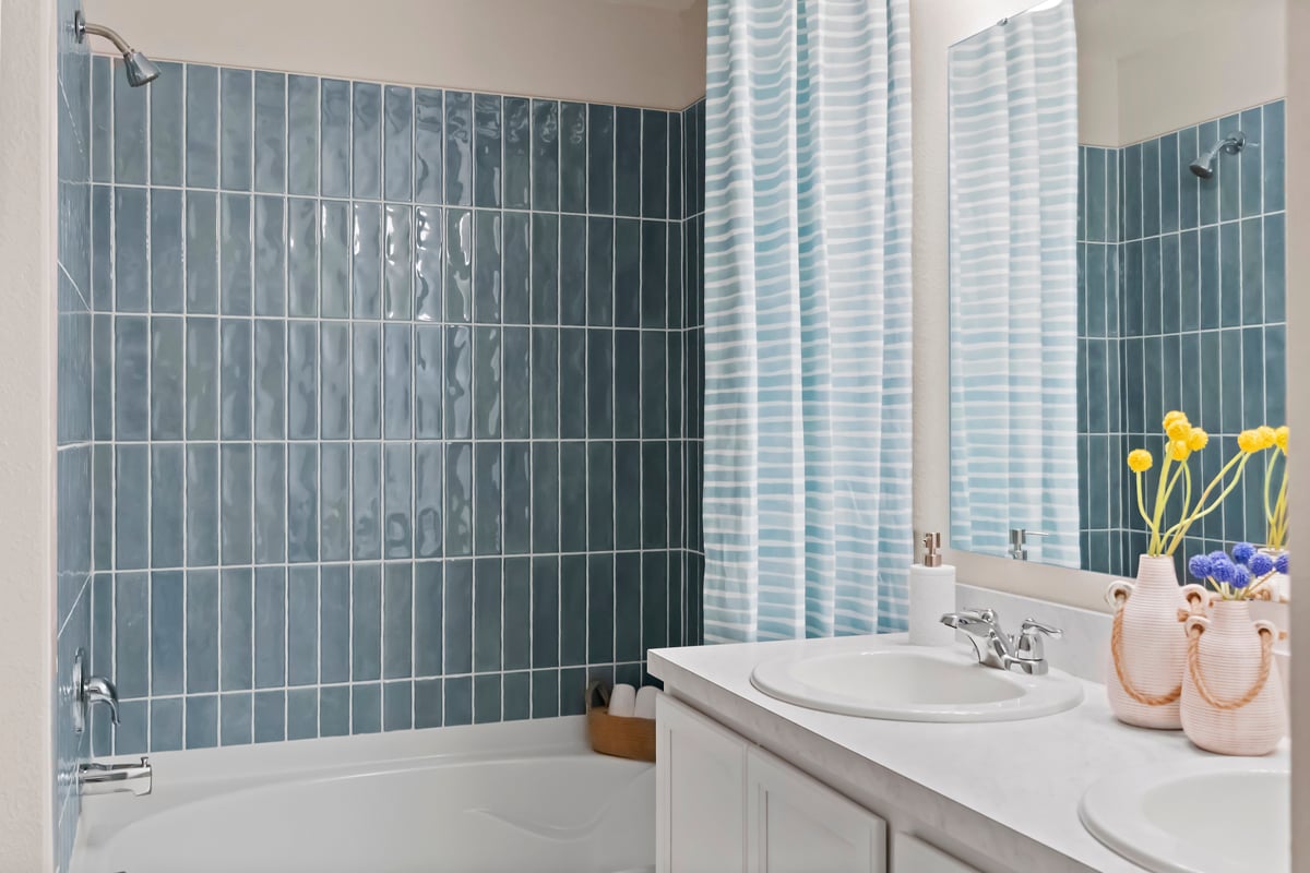 Garden tub with tile surround at primary bath