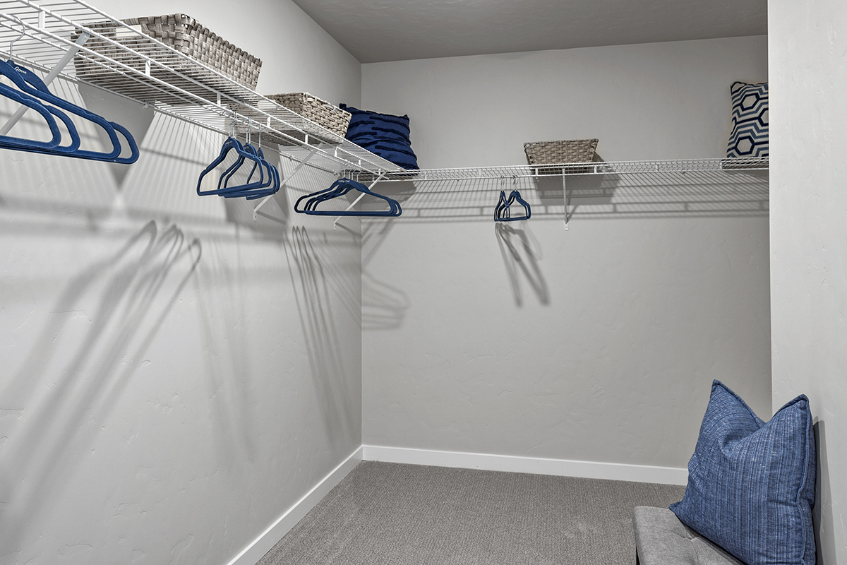 Walk-in closet at primary suite