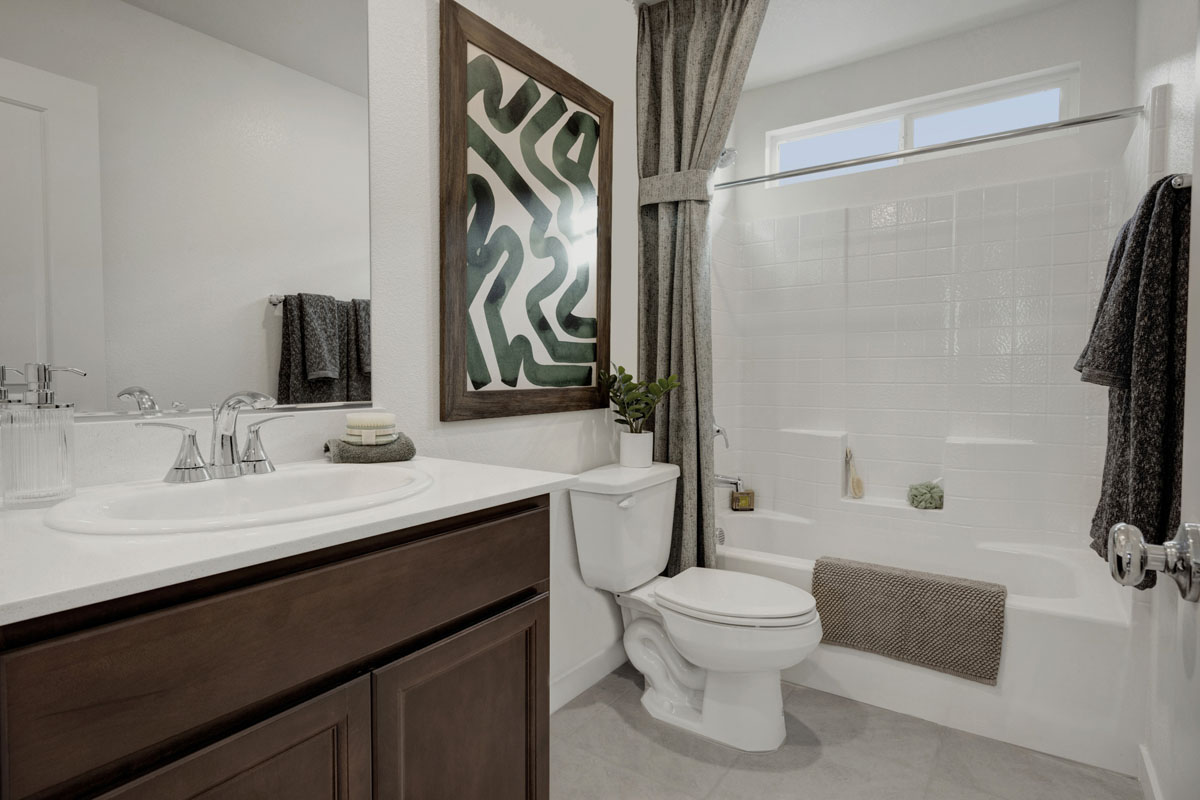 Tub with fiberglass surround at guest bath