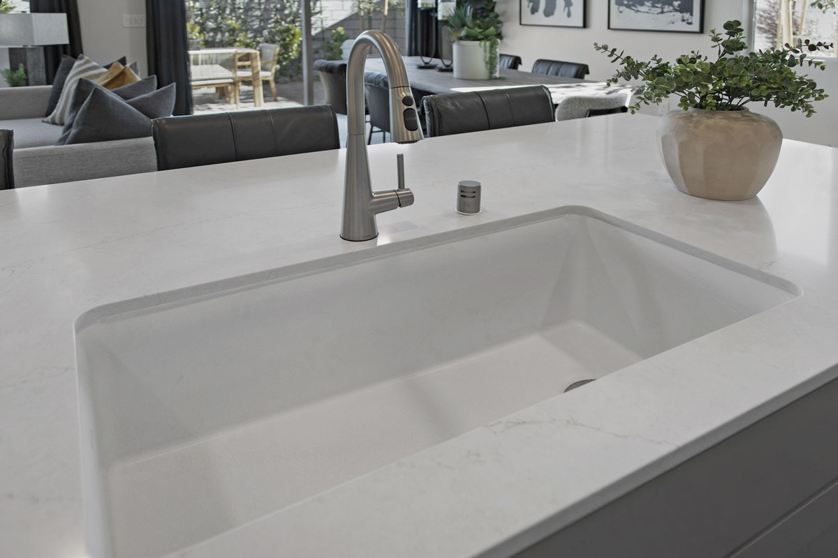 Kohler® single-basin sink and Moen® Sleek faucet