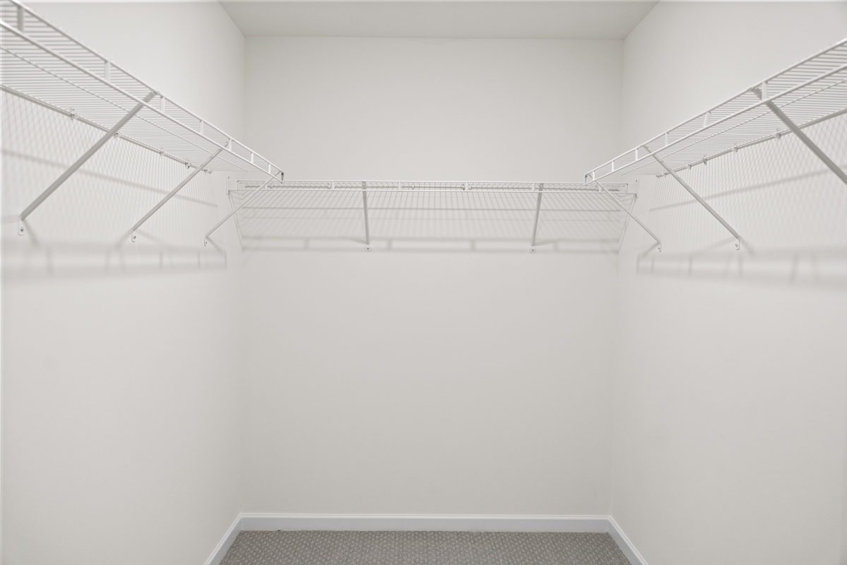 Walk-in closet at primary suite