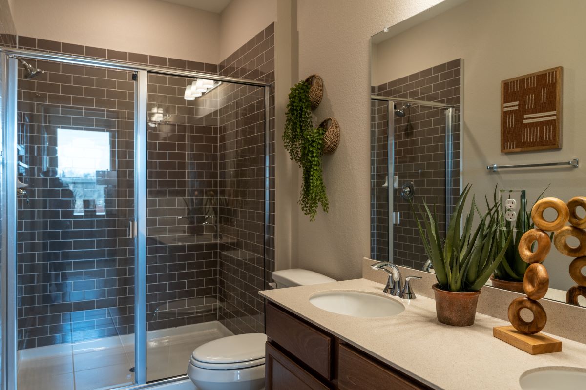 Walk-in shower with tile surround at primary bath