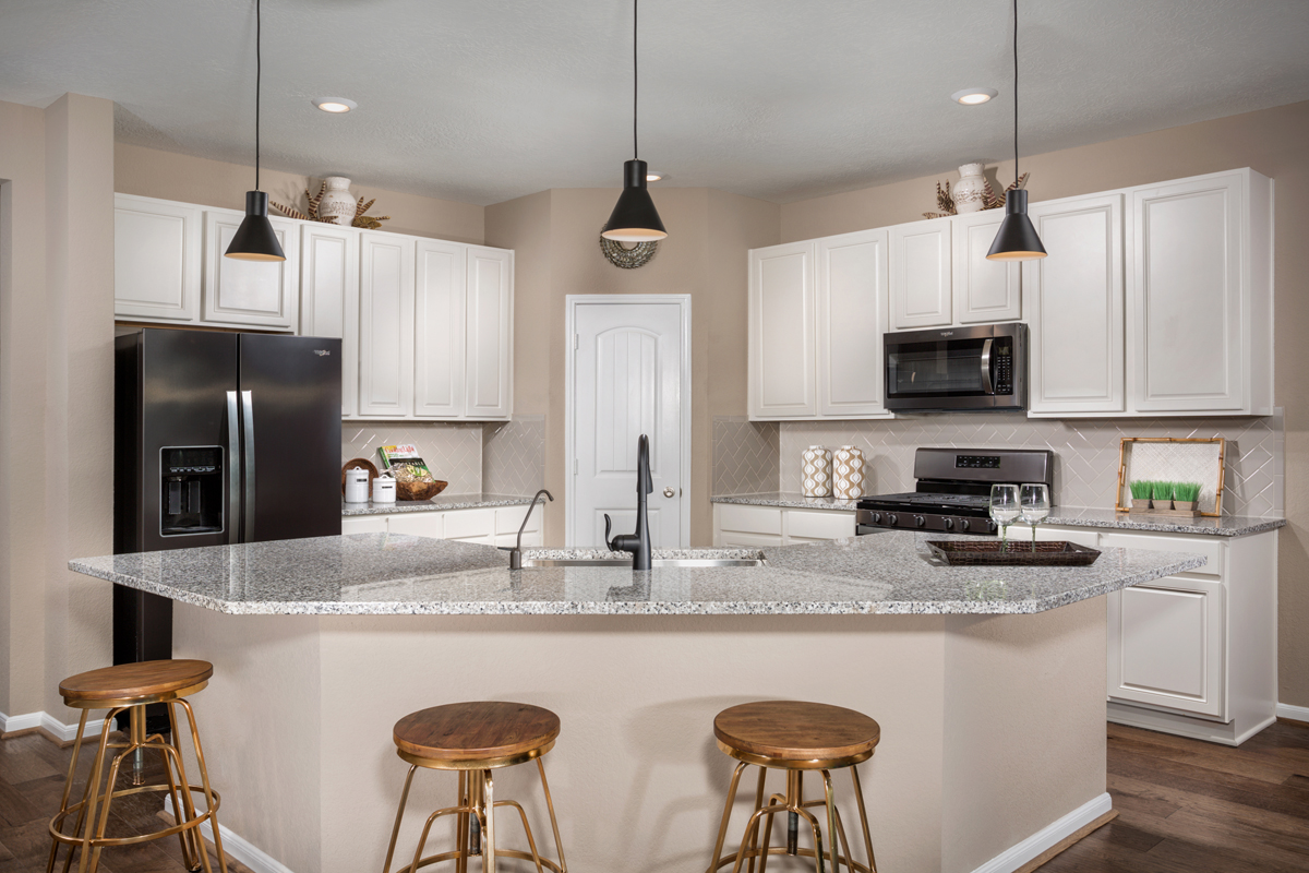 New Homes in Missouri City , TX - Olympia Falls Plan 2130 Kitchen as modeled at Bryan Crossing
