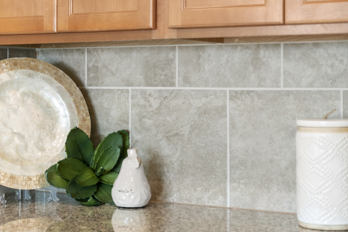 Tile backsplash at kitchen