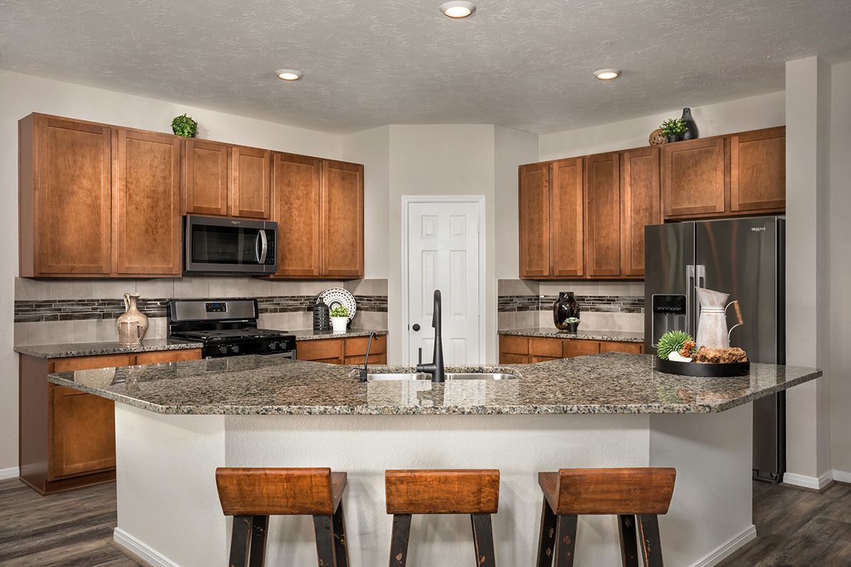 New Homes in Alvin, TX - Imperial Forest Plan 2130 Kitchen as modeled at Sunset Grove
