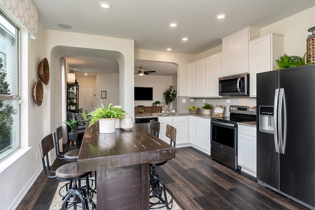 New Homes in San Antonio, TX - Dove Heights Plan 1523 Kitchen as modeled at Champions Landing