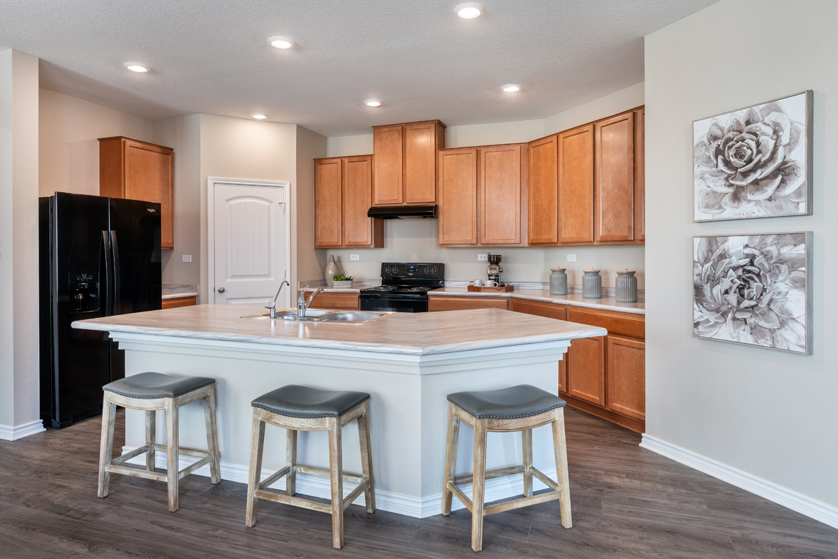 New Homes in Elmendorf, TX - Southton Cove Plan 1548 Kitchen as modeled at Deer Crest