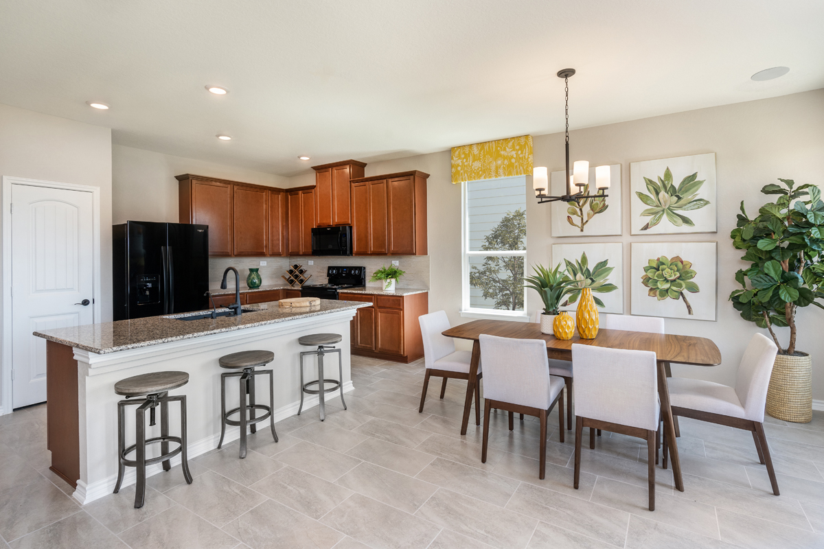 New Homes in San Antonio, TX - Preserve at Culebra - Classic Collection Plan 1657 Dining Room & Kitchen
